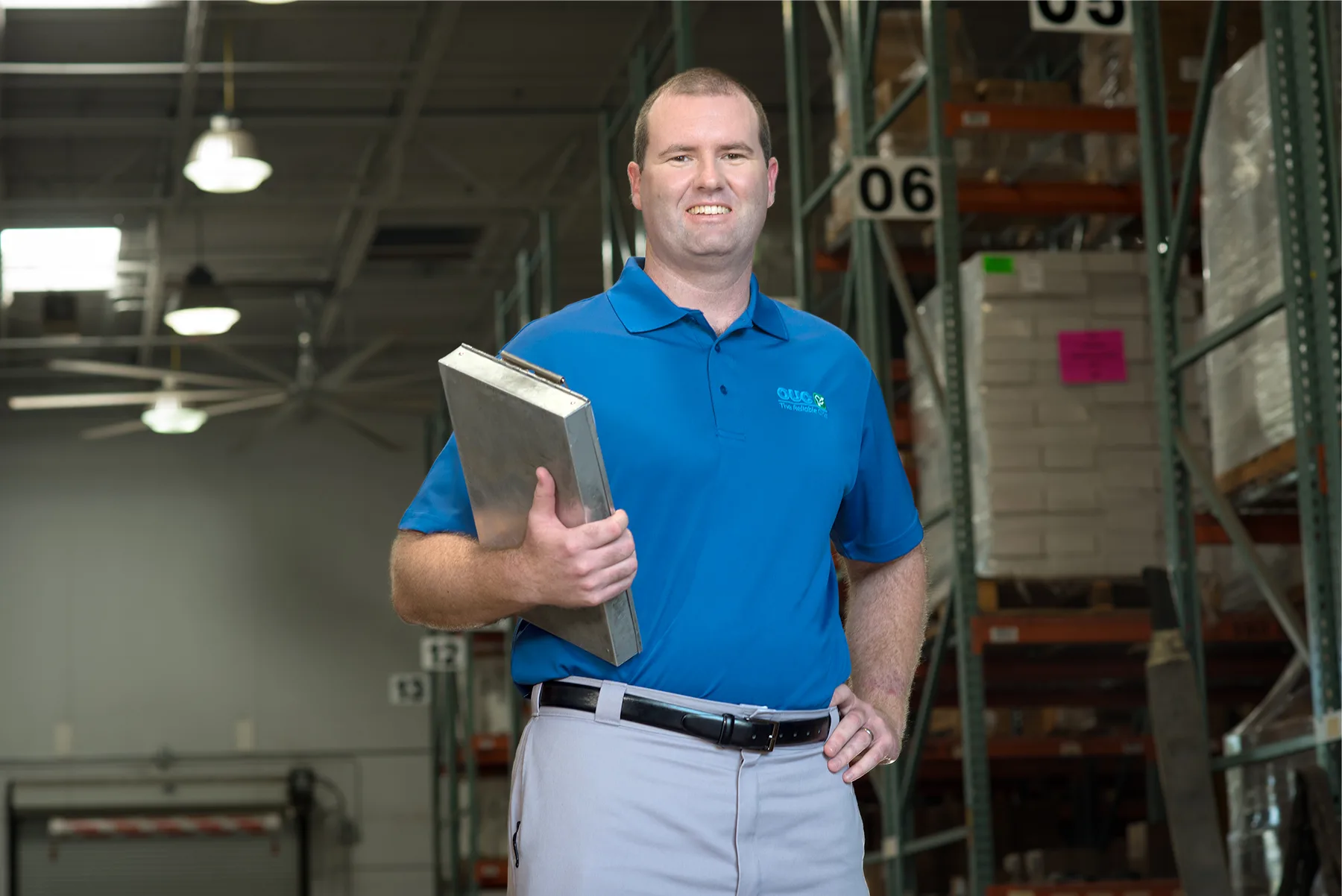 OUC employee in a warehouse