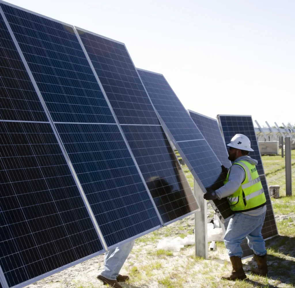 Solar panel being adjusted by OUC employee
