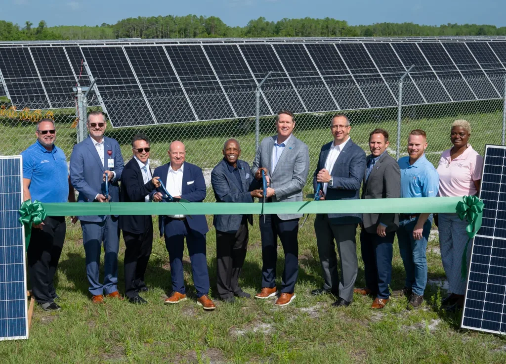 Ribbon cutting ceremony with group of businesspeople