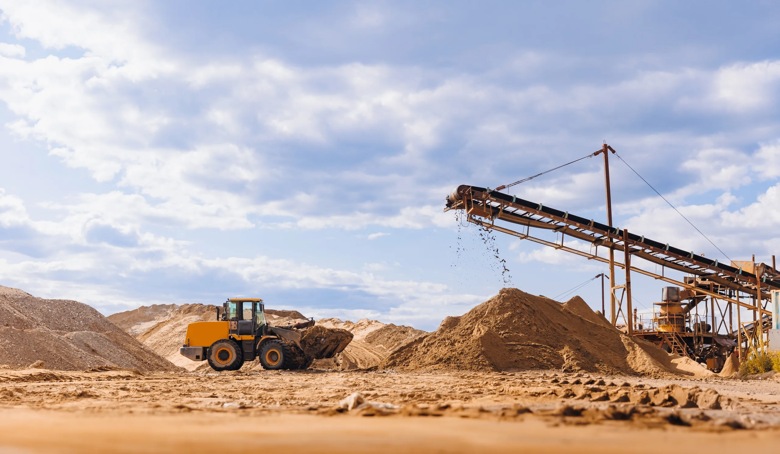 Front loader carrying dirt at a construction site