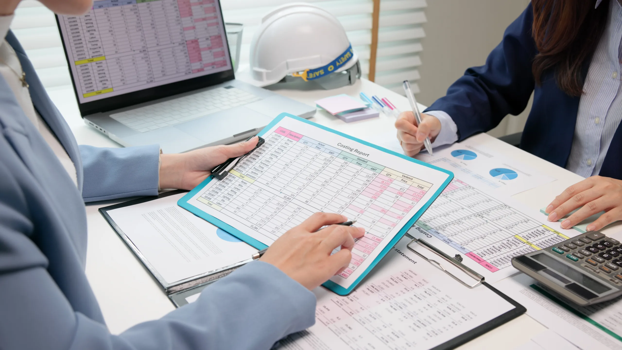 People reviewing data at a desk